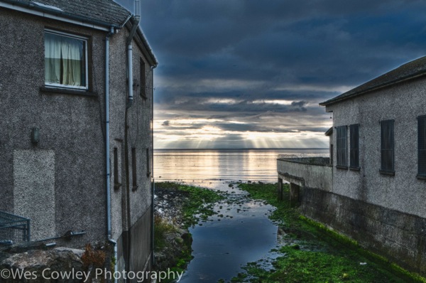 Carnlough sunrise between buildings 2